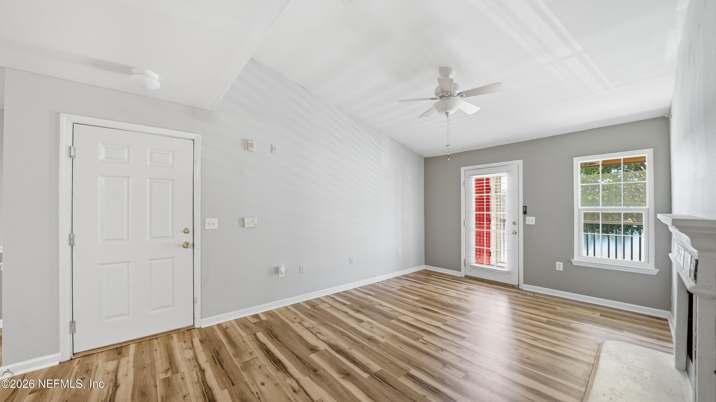 23699 Bahama Point, Unit 1126 Fernandina Beach, FL 32034 - Photo 5 of 50 a view of empty room with wooden floor and fan