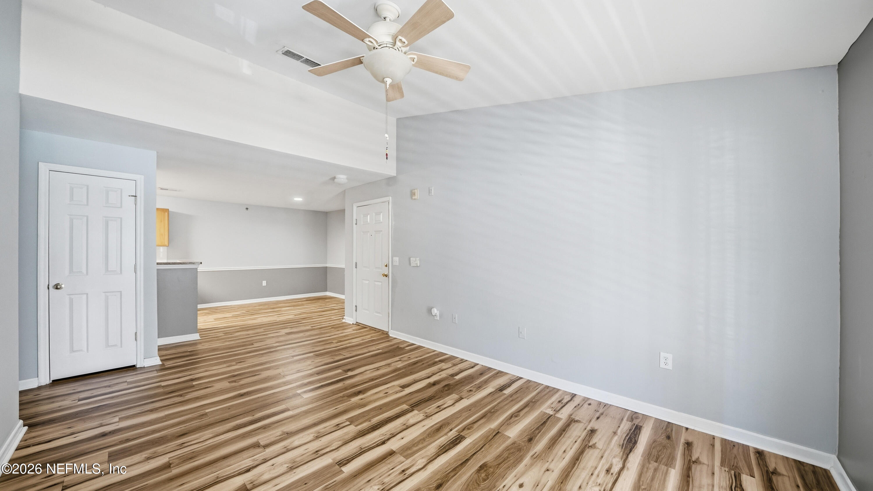 23699 Bahama Point, Unit 1126 Fernandina Beach, FL 32034 - Photo 7 of 50 wooden floor in an empty room with a window