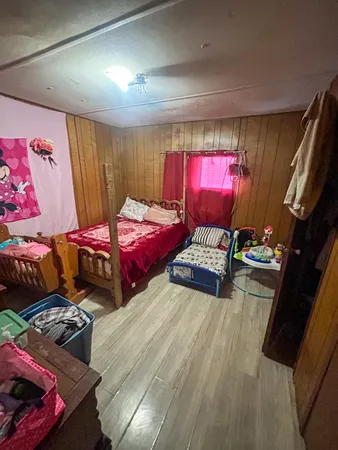 a bedroom with a bed and dresser