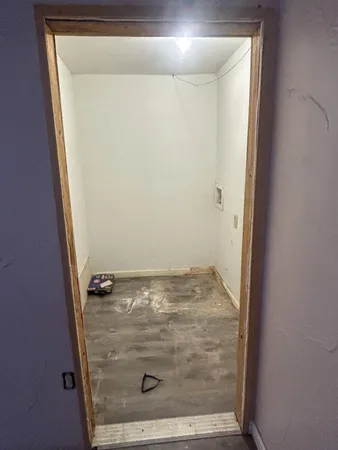 an empty room with wooden floor