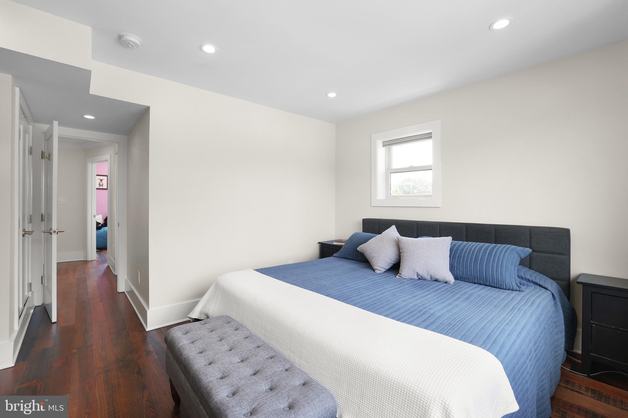 1225 Gallatin Street Northeast Washington, DC 20017 - Photo 11 of 28 a bedroom with a bed and wooden floor