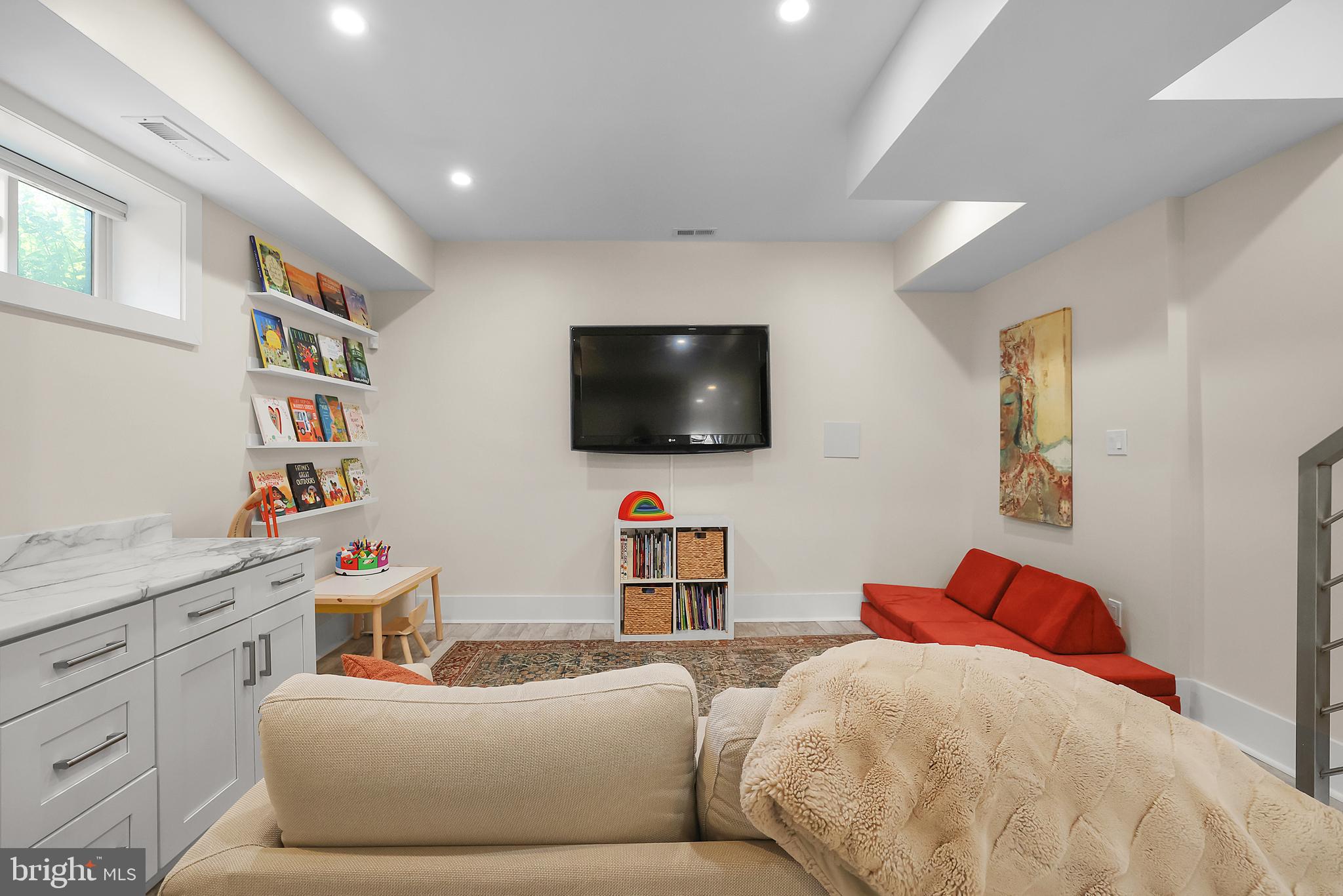 1225 Gallatin Street Northeast Washington, DC 20017 - Photo 19 of 28 a bedroom with a bed and a flat screen tv