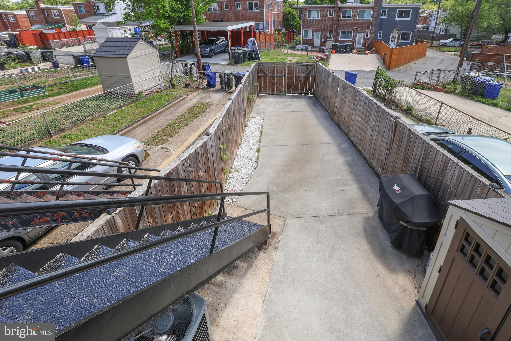 1225 Gallatin Street Northeast Washington, DC 20017 - Photo 26 of 28 a view of a balcony with wooden floor and outdoor seating