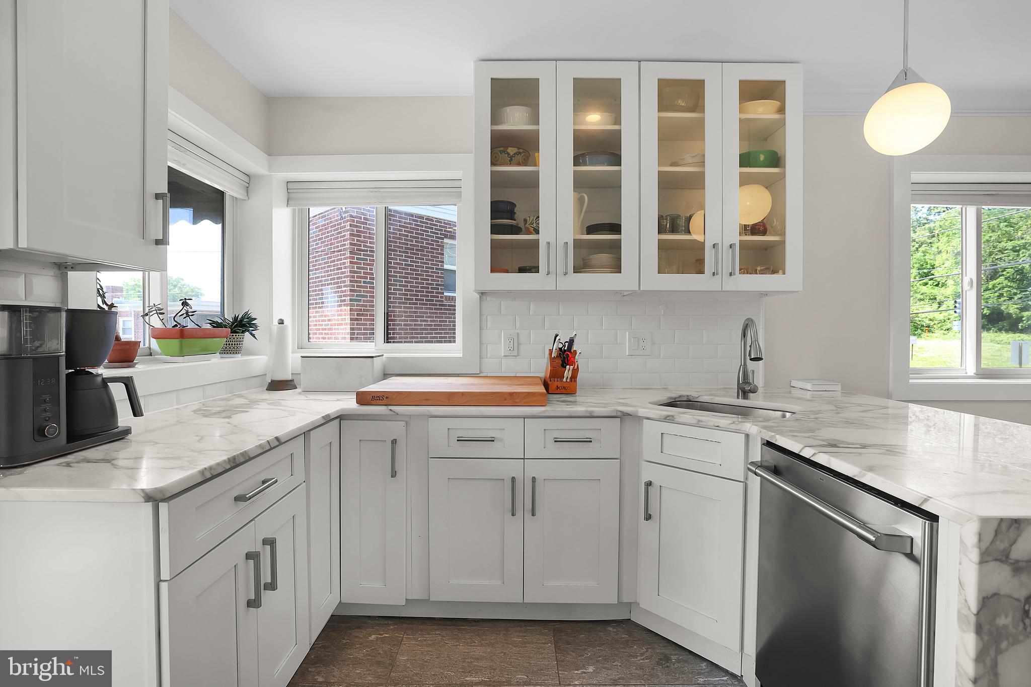 1225 Gallatin Street Northeast Washington, DC 20017 - Photo 8 of 28 a kitchen with white cabinets and sink