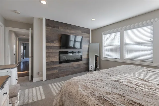 a bathroom with a shower sink and mirror