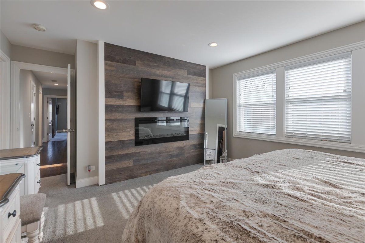 9124 South Bell Avenue Chicago, IL 60643 - Photo 18 of 35 a bedroom with a bed and a television