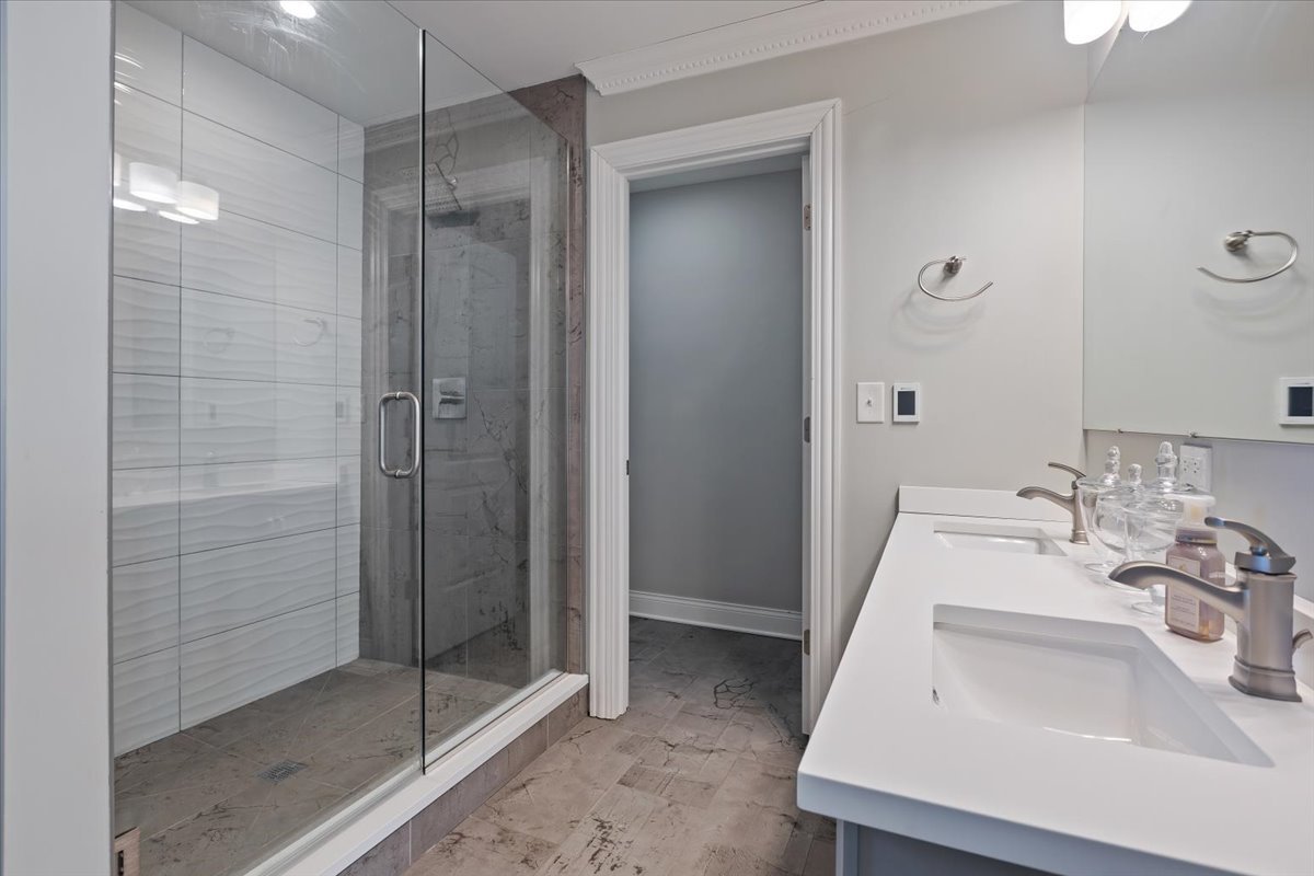 9124 South Bell Avenue Chicago, IL 60643 - Photo 21 of 35 a bathroom with a shower sink and mirror