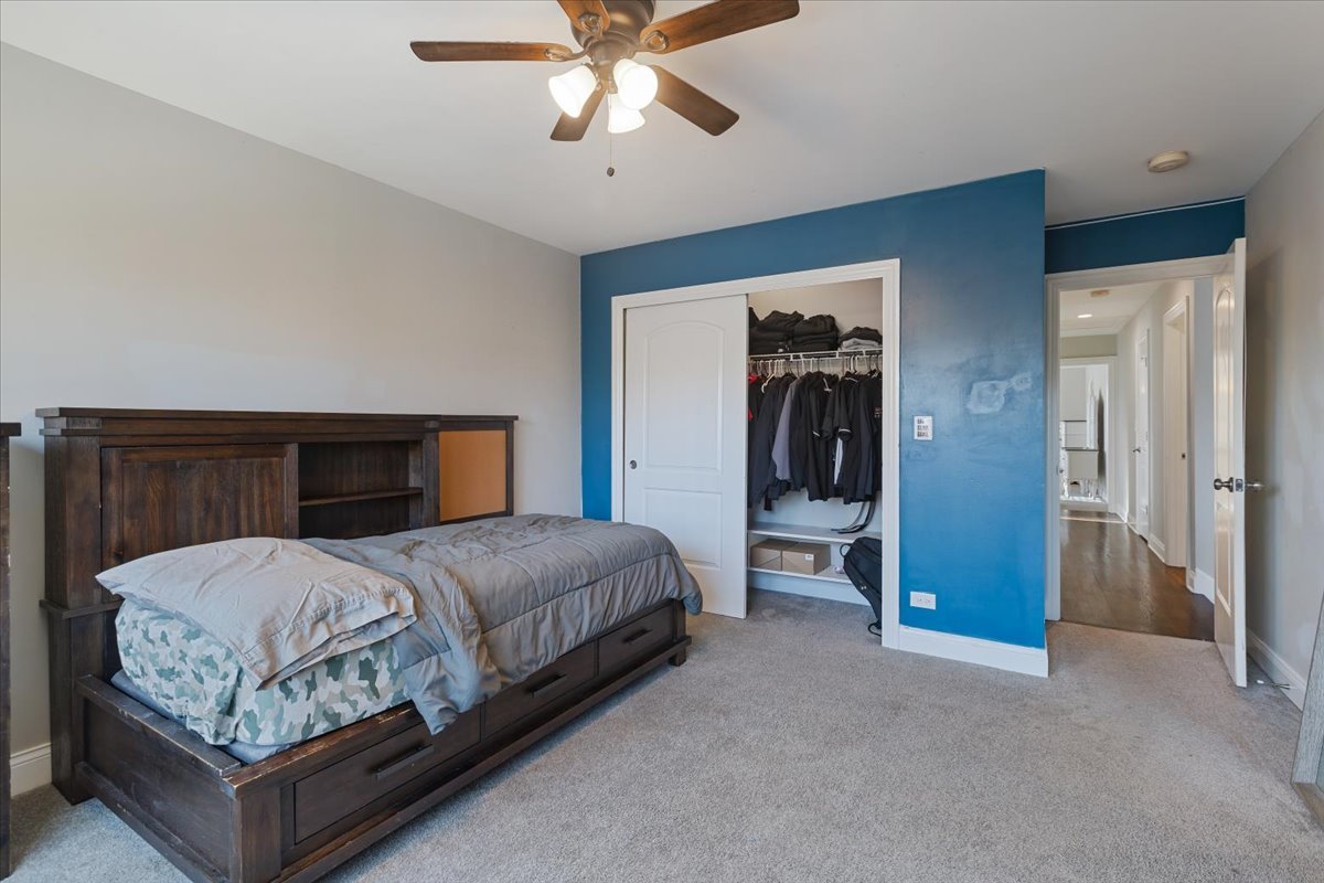 9124 South Bell Avenue Chicago, IL 60643 - Photo 23 of 35 a bedroom with a bed and a chandelier