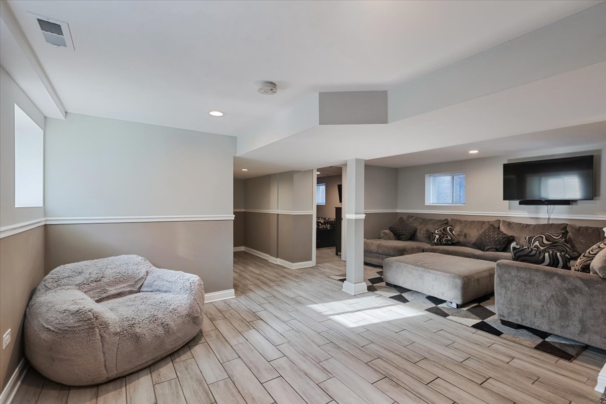 9124 South Bell Avenue Chicago, IL 60643 - Photo 28 of 35 a living room with furniture and a flat screen tv