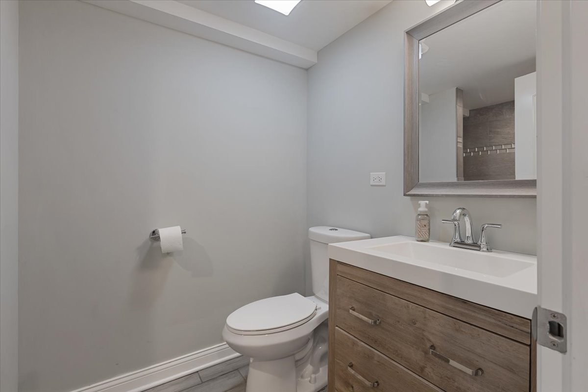 9124 South Bell Avenue Chicago, IL 60643 - Photo 30 of 35 a bathroom with a sink toilet and vanity