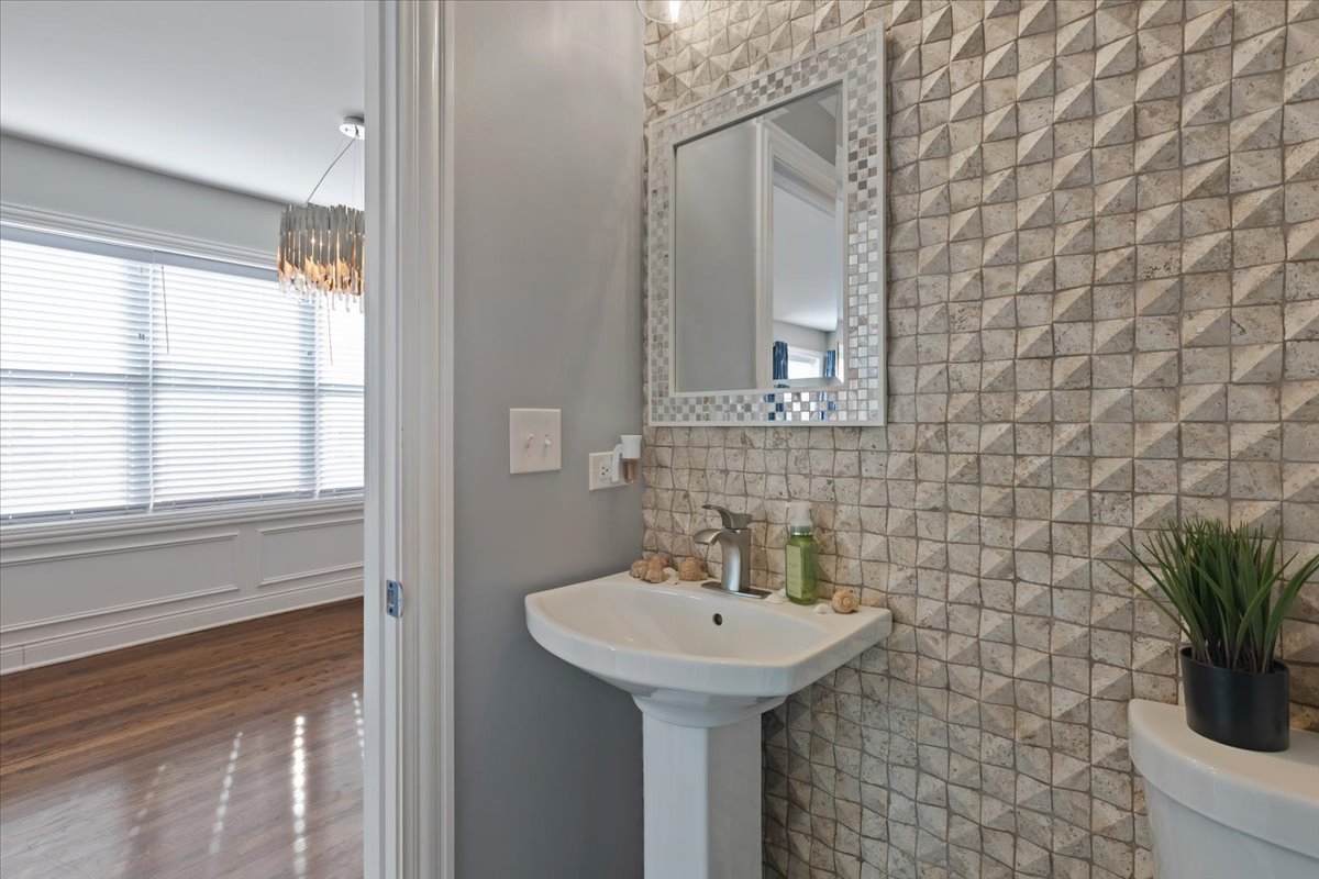 9124 South Bell Avenue Chicago, IL 60643 - Photo 7 of 35 a bathroom with a sink a mirror and a shower