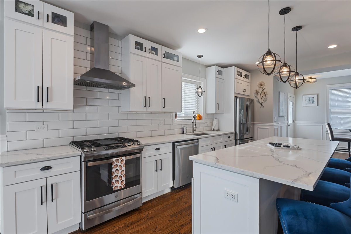 9124 South Bell Avenue Chicago, IL 60643 - Photo 8 of 35 a kitchen with stainless steel appliances a stove a sink dishwasher and cabinets with wooden floor