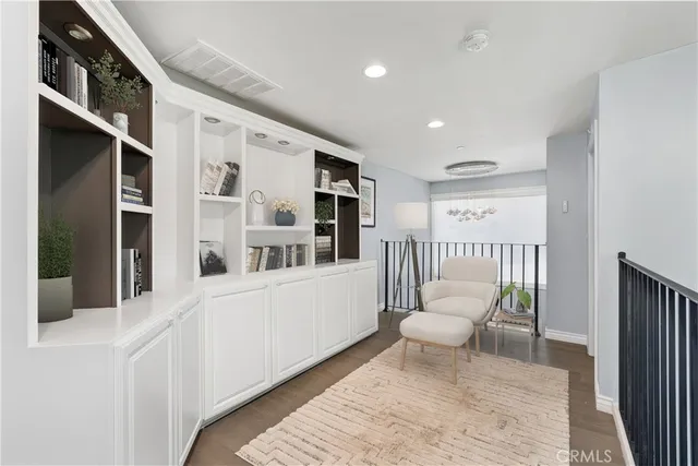 a bedroom with a white bed and white walls