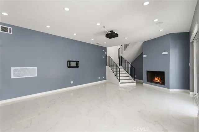 a view of an empty room with a fireplace