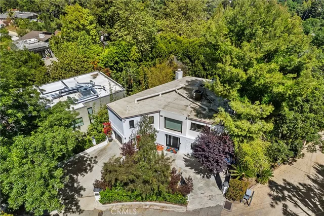 an aerial view of a house with a yard and garden
