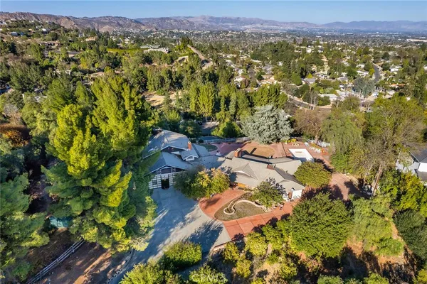 an aerial view of residential house with outdoor space