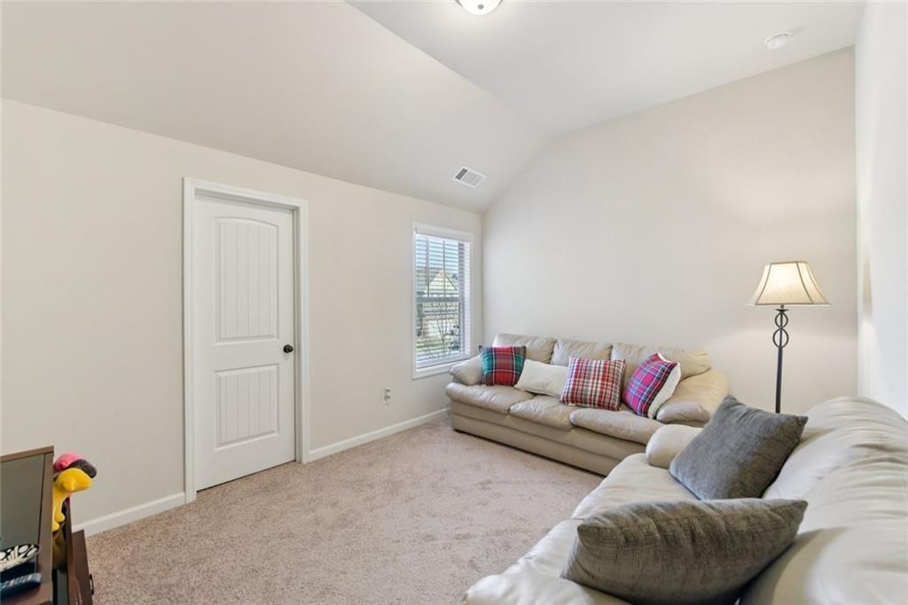 2002 Bridgewater Pass Hampton, GA 30228 - Photo 21 of 35 a living room with furniture and a couch