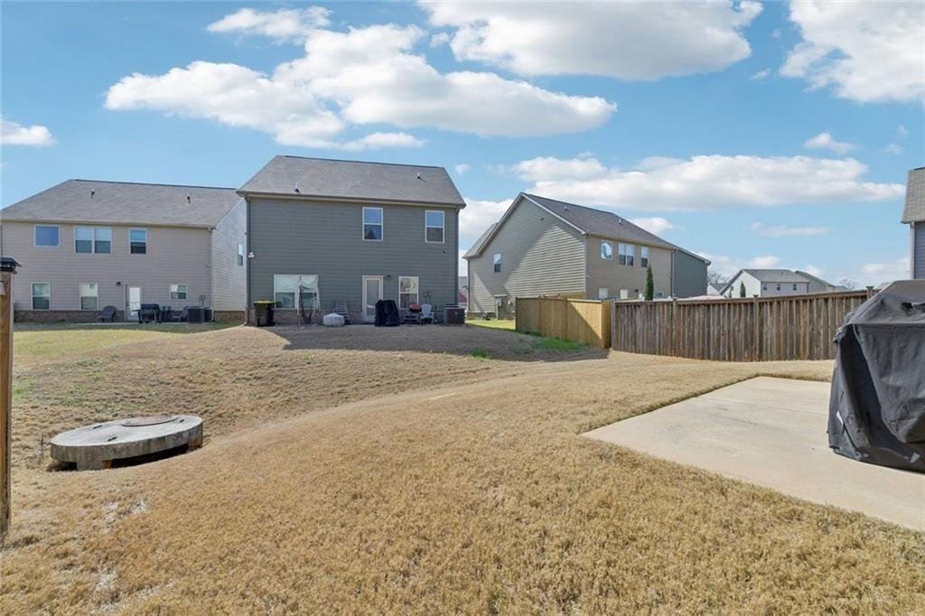 2002 Bridgewater Pass Hampton, GA 30228 - Photo 31 of 35 a view of a house with a yard