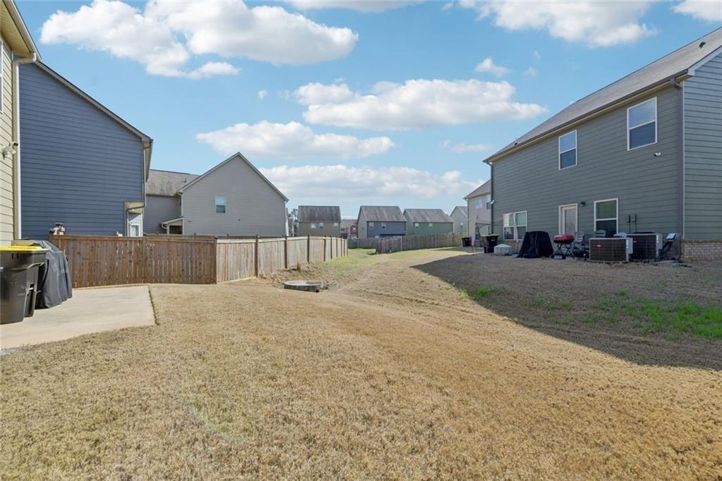 2002 Bridgewater Pass Hampton, GA 30228 - Photo 35 of 35 a view of a house with a yard