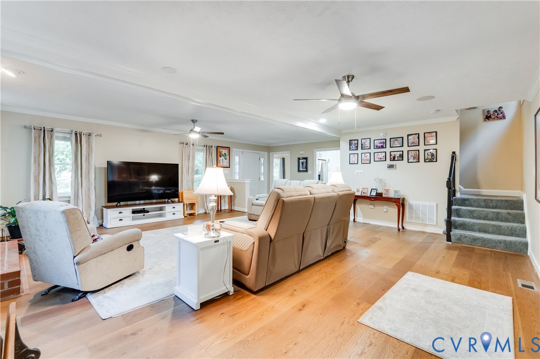 19229 Turkey Road Rockville, VA 23146 - Photo 12 of 44 a living room with furniture and a flat screen tv