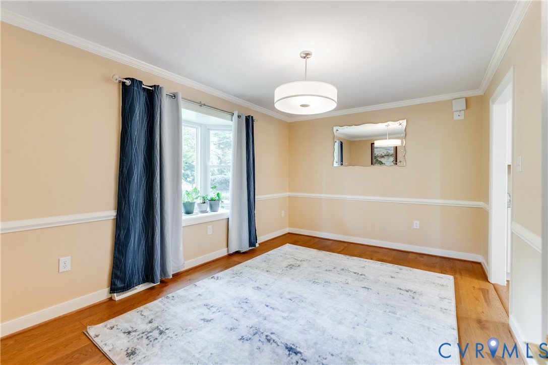 19229 Turkey Road Rockville, VA 23146 - Photo 14 of 44 an empty room with wooden floor and windows