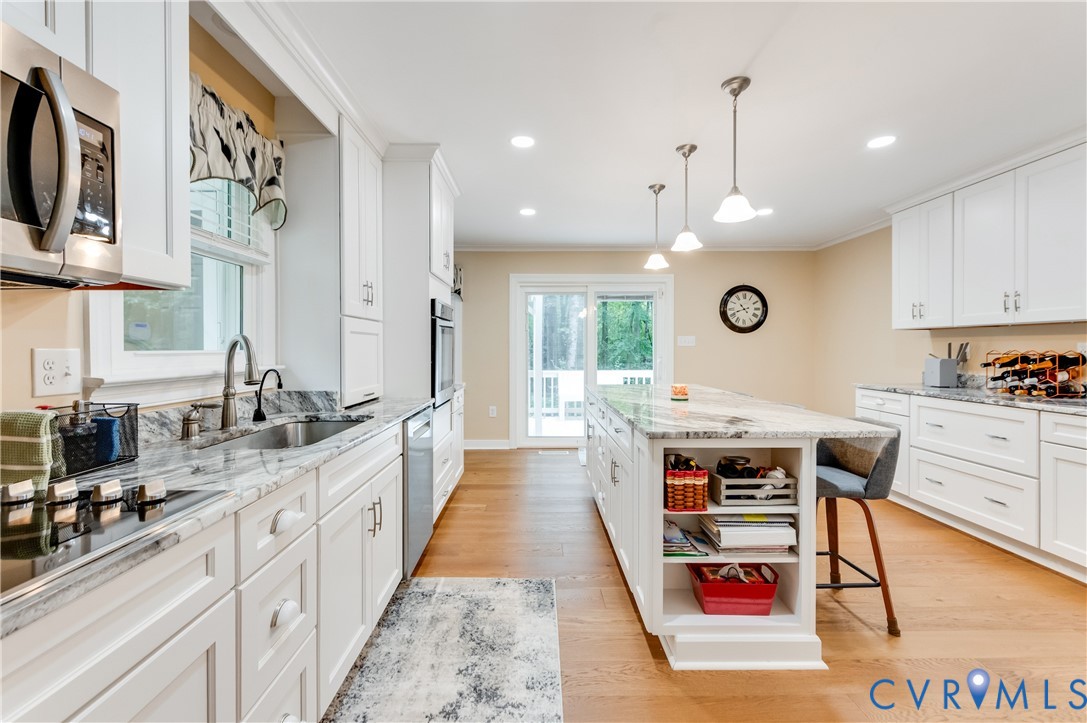 19229 Turkey Road Rockville, VA 23146 - Photo 16 of 44 a large white kitchen with lots of counter space wooden floor and appliances