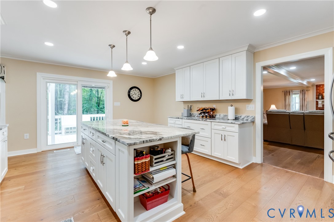 19229 Turkey Road Rockville, VA 23146 - Photo 18 of 44 a kitchen with kitchen island granite countertop a stove and a view of living room