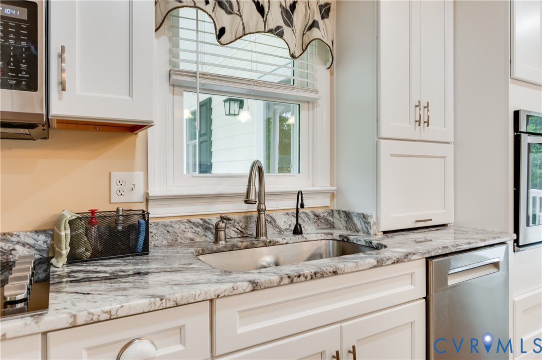 19229 Turkey Road Rockville, VA 23146 - Photo 19 of 44 a kitchen with stainless steel appliances granite countertop a sink and a white cabinets