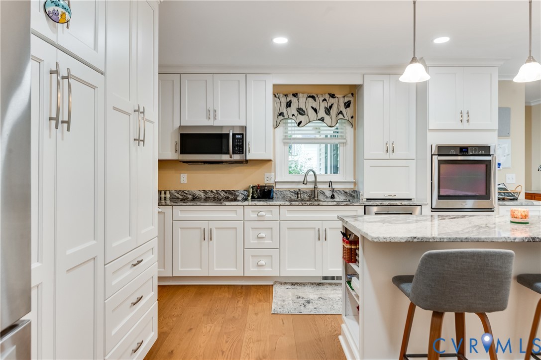19229 Turkey Road Rockville, VA 23146 - Photo 20 of 44 a kitchen with stainless steel appliances granite countertop a stove a sink and a refrigerator