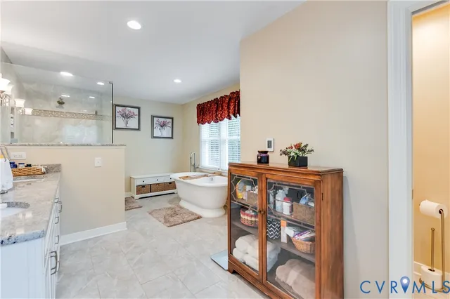 a kitchen with granite countertop a sink and cabinets
