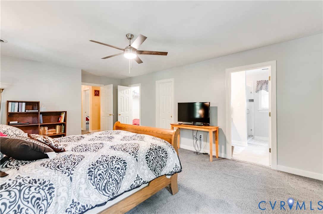 19229 Turkey Road Rockville, VA 23146 - Photo 31 of 44 a bedroom with a bed and a flat screen tv