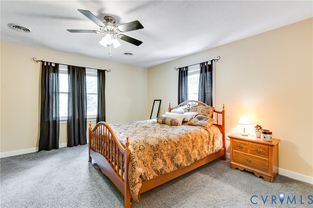 19229 Turkey Road Rockville, VA 23146 - Photo 33 of 44 a bed room with a bed and a ceiling fan
