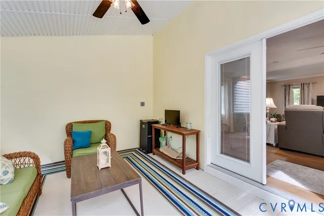 a balcony with wooden floor and fence