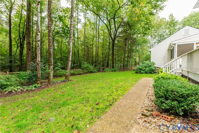 a front view of a house with a yard and porch