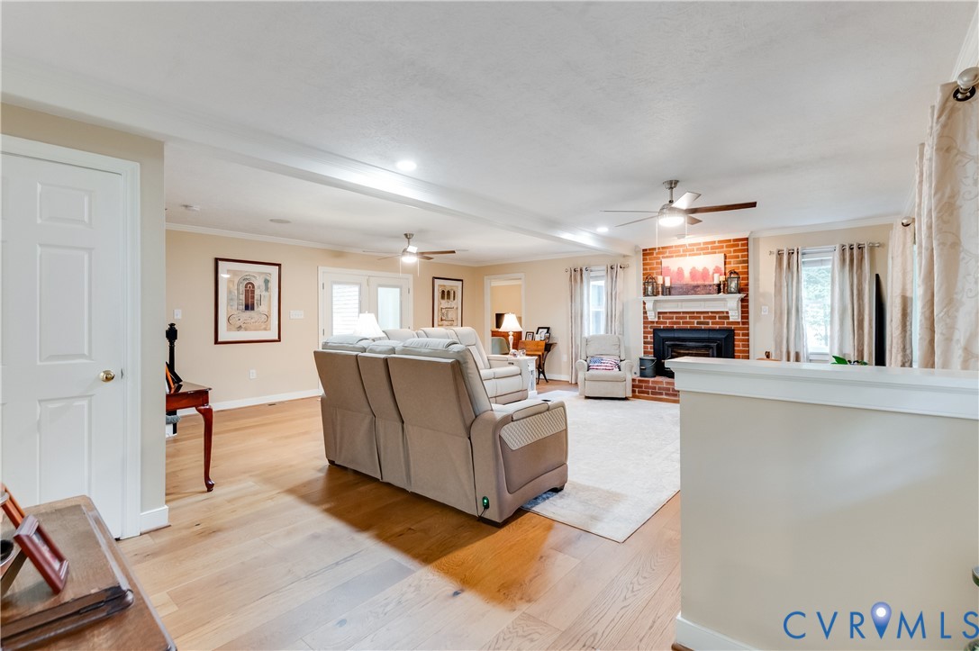 19229 Turkey Road Rockville, VA 23146 - Photo 9 of 44 a living room with furniture a flat screen tv and a refrigerator