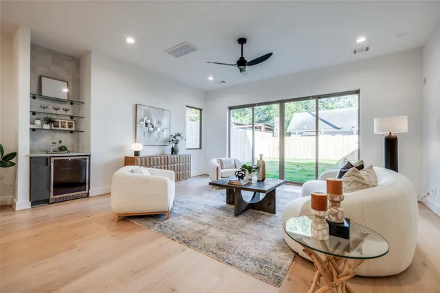 a spacious bathroom with double sink and shower