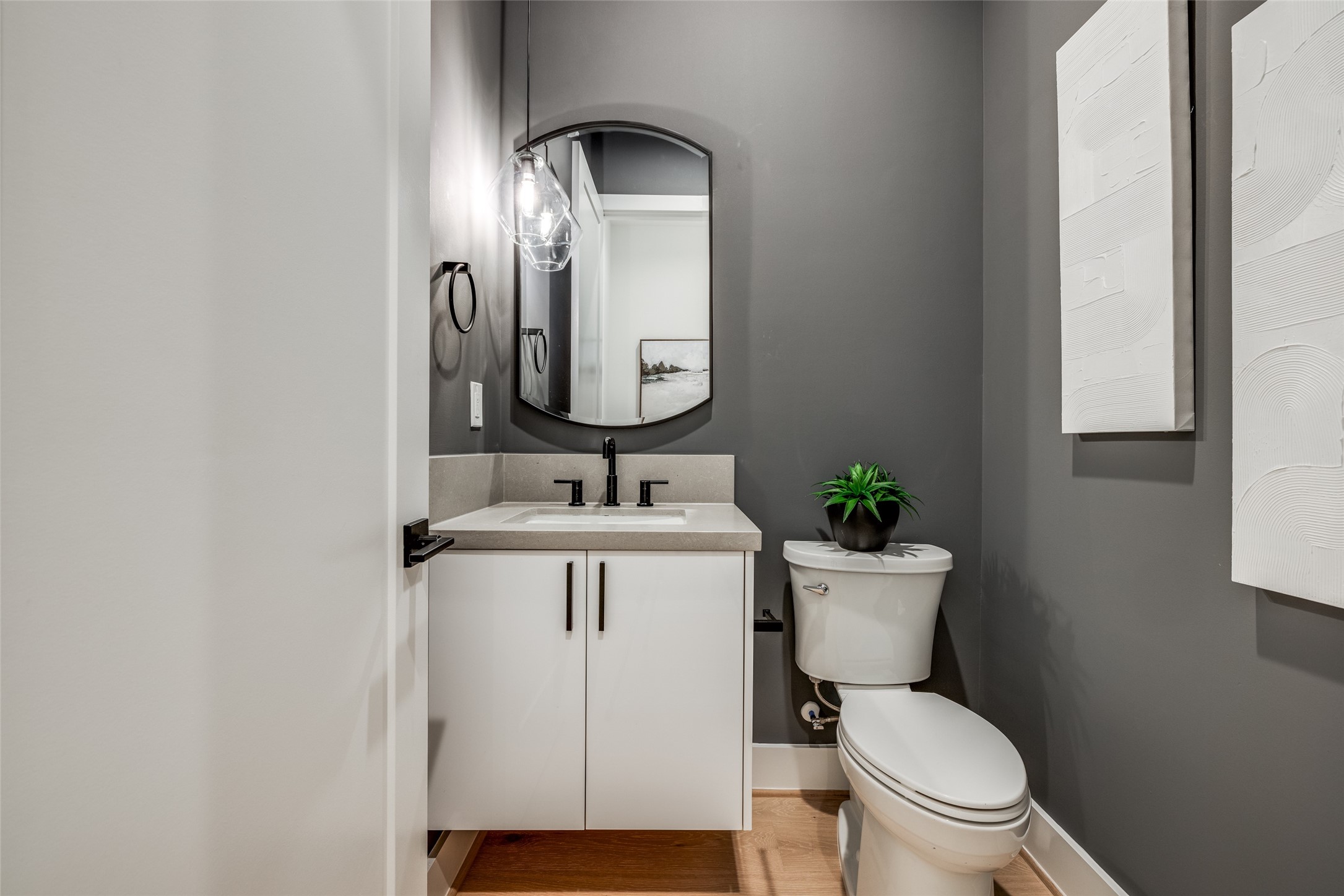 2412 Elmen Street Houston, TX 77019 - Photo 25 of 43 a bathroom with a toilet sink and mirror
