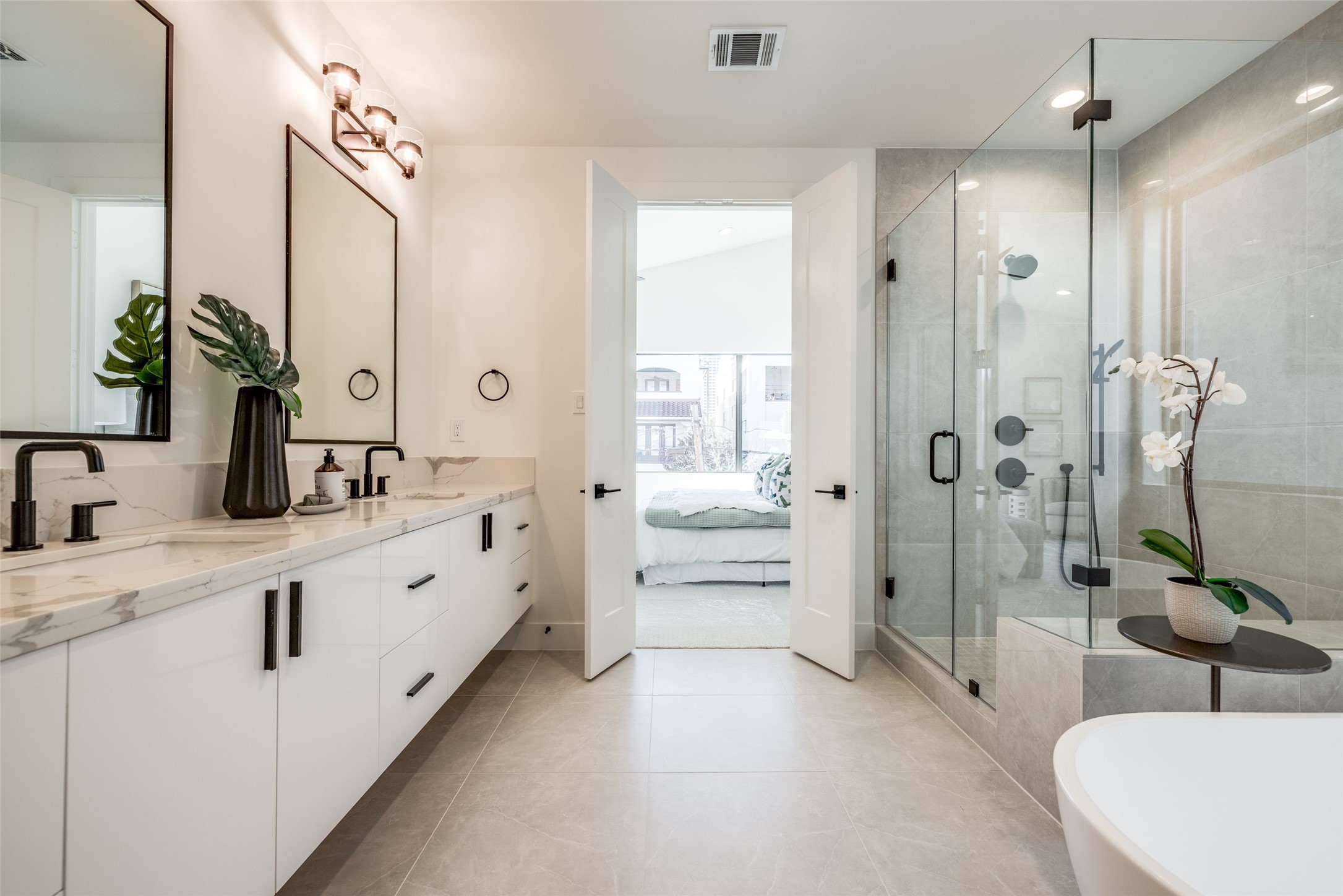2412 Elmen Street Houston, TX 77019 - Photo 29 of 43 a spacious bathroom with double sink and shower