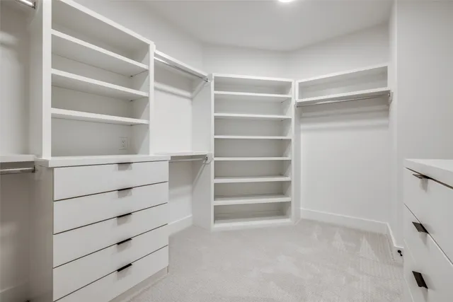 a shelf with books and a window