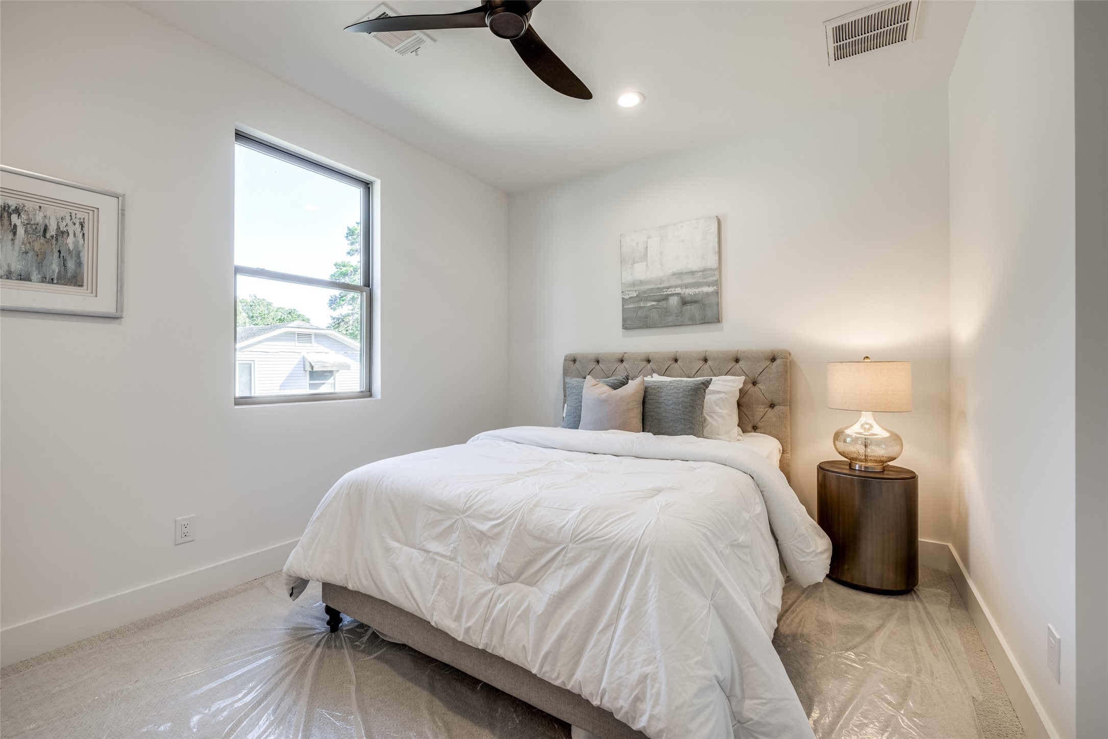 2412 Elmen Street Houston, TX 77019 - Photo 37 of 43 a bedroom with a bed and a window