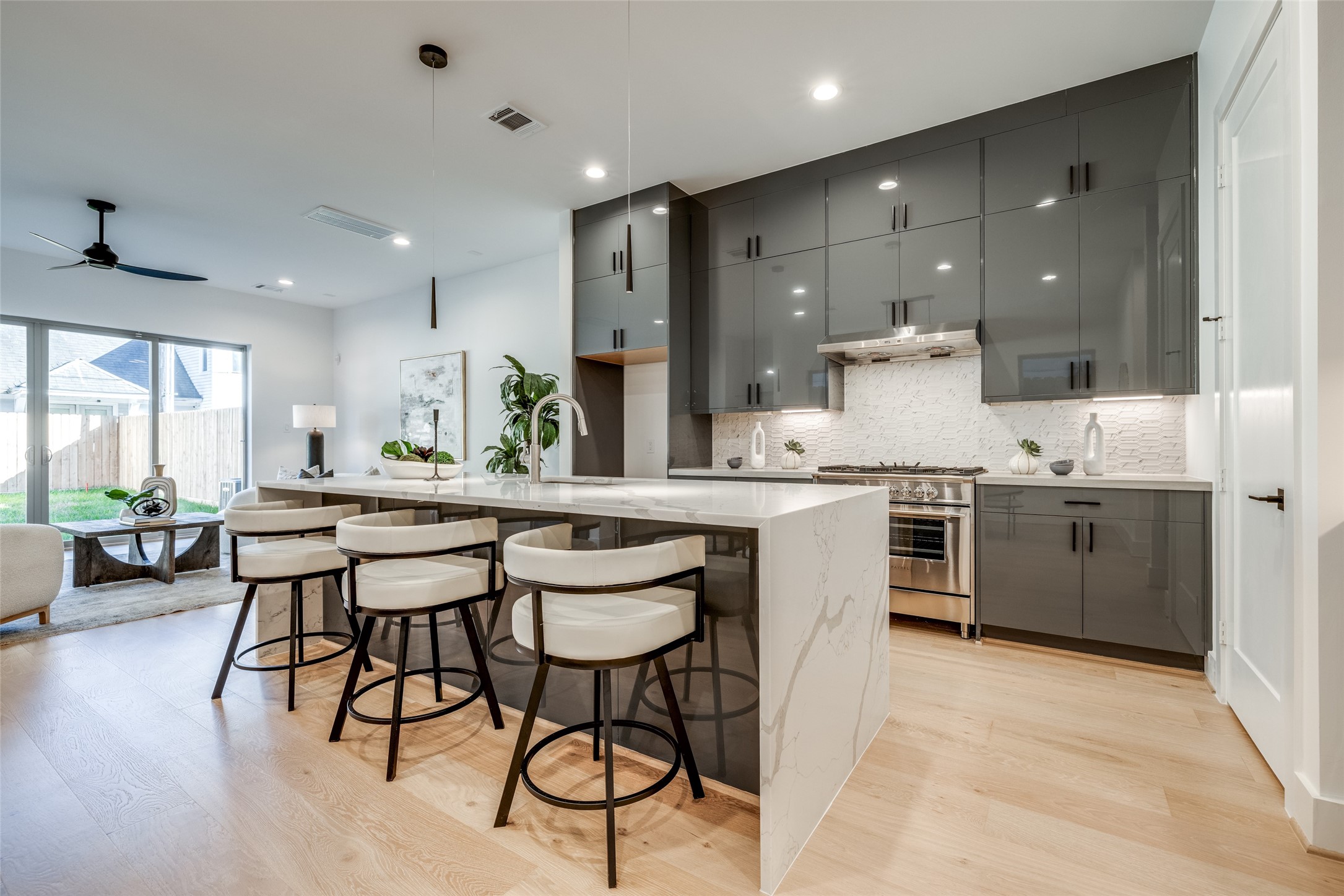 2412 Elmen Street Houston, TX 77019 - Photo 11 of 43 a kitchen with a table chairs sink and cabinets