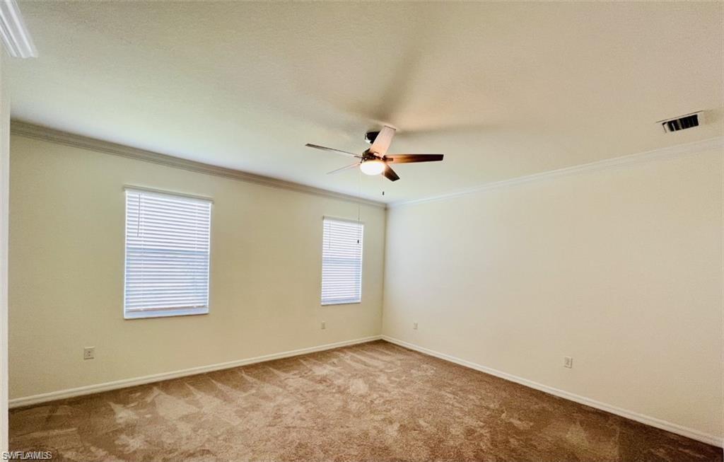 2775 Citrus Street Naples, FL 34120 - Photo 11 of 31 an empty room with windows and fan