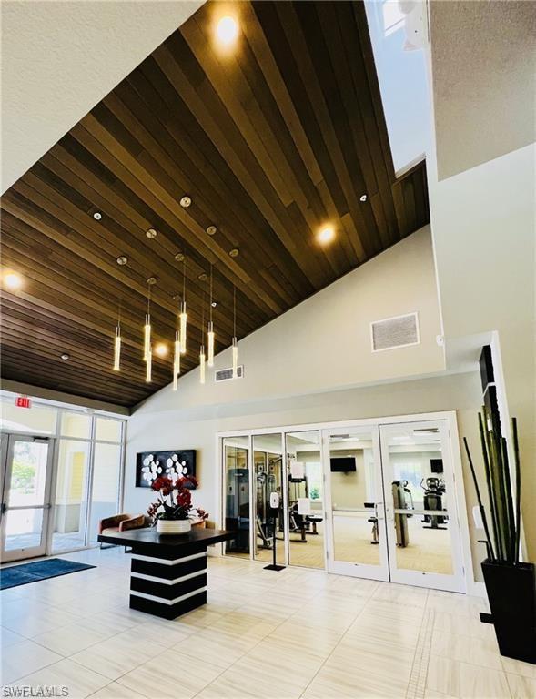 2775 Citrus Street Naples, FL 34120 - Photo 28 of 31 a living room with lots of furniture and gym equipment