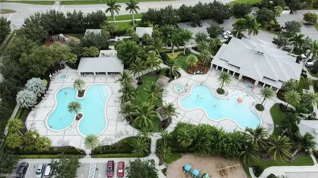 an aerial view of a house with yard