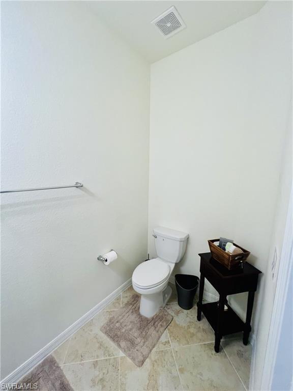 2775 Citrus Street Naples, FL 34120 - Photo 6 of 31 a bathroom with a toilet and a sink