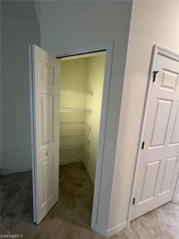 a bathroom with a shower and a sink