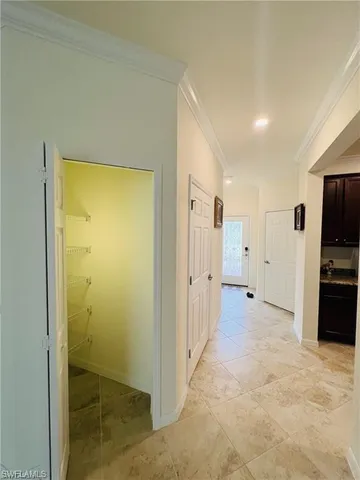 a view of a hallway with a bathroom