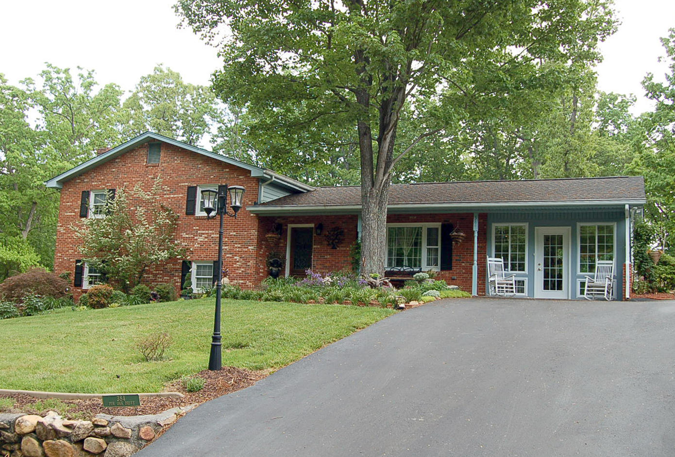 384 Pin Oak Drive Blue Ridge, VA 24064 - Photo 1 of 57 a front view of a house with garden