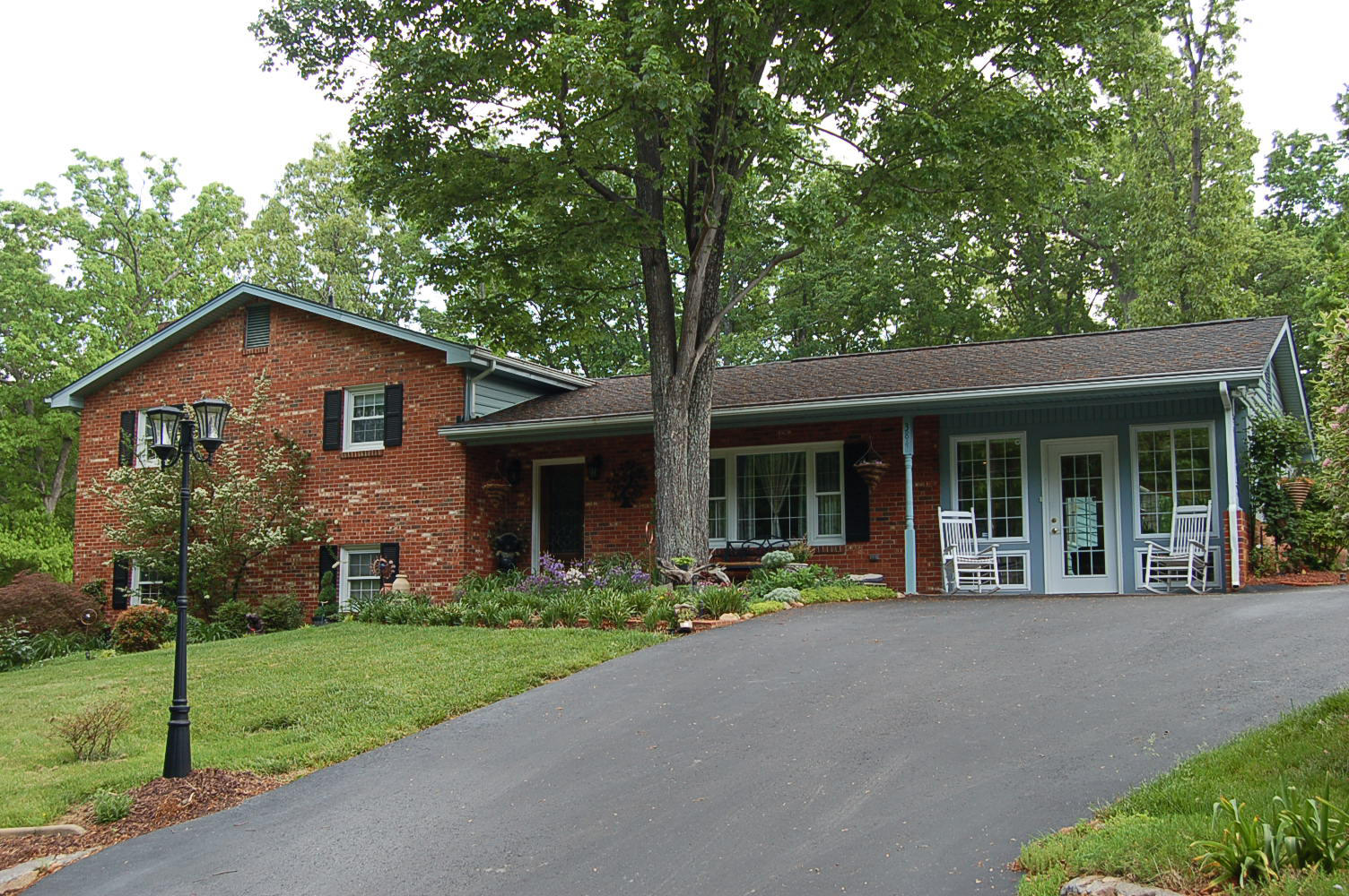 384 Pin Oak Drive Blue Ridge, VA 24064 - Photo 2 of 57 a front view of a house with a yard and porch