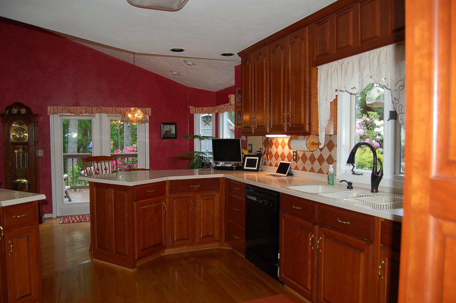 384 Pin Oak Drive Blue Ridge, VA 24064 - Photo 16 of 57 a kitchen with stainless steel appliances kitchen island granite countertop a sink dishwasher stove and cabinets with wooden floor